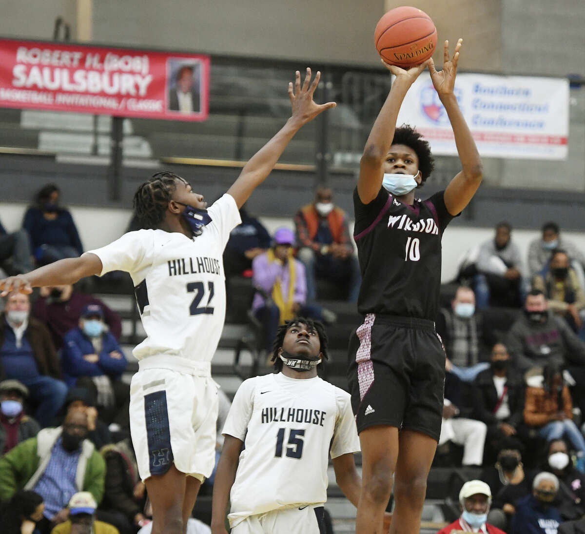 Hillhouse's Avery Sutton, left, defends a shot by Windsor's Tyler Betsey during the Academic's 76-70 victory at the Robert Saulsbury Basketball Invitational tournament at the Floyd Little Athletic Center in New Haven, Conn. on Saturday, February 2, 2022. Betsey, now at St. Thomas More, was selected Gatorade's Connecticut Boys Basketball Player of the Year.