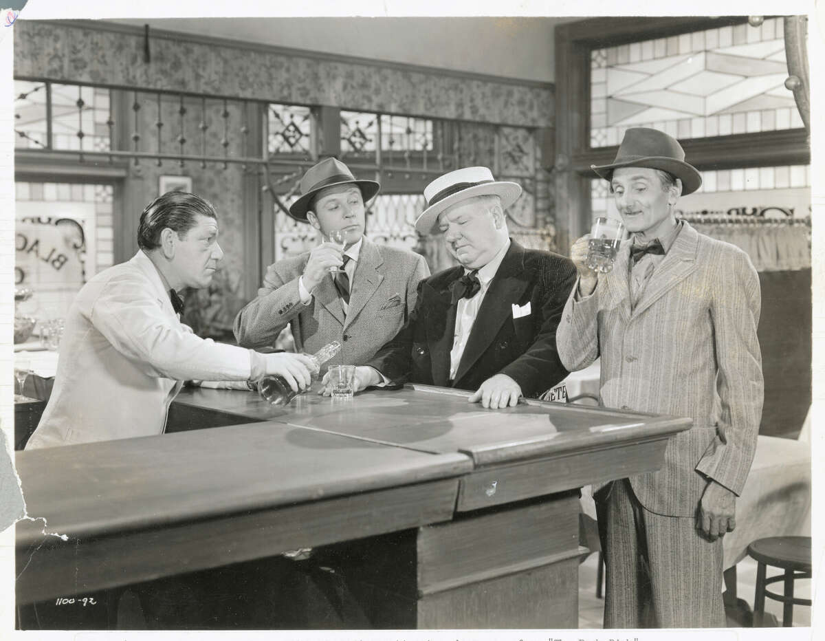 W.C. Fields indulges in his favorite pastime in a bar scene from "The Bank Dick." The opening credits contain a reference to "A. Pismo Clam."