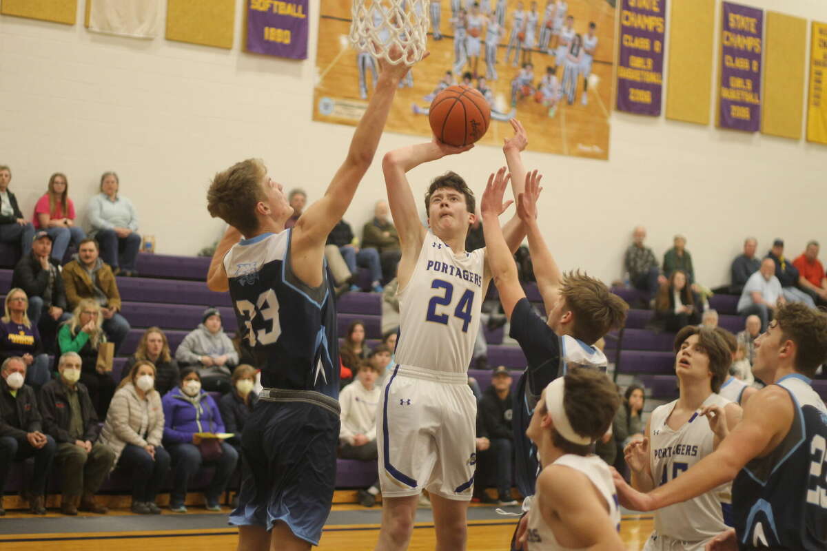 In this file photo, Onekama's Luke Bradford puts up a shot on March 9 during the Portagers' 51-48 loss to Brethren in a Division 4 district semifinal in Frankfort. The Onekama Athletic Boosters are accepting applications for its vendor and crafts show slated for June 11.