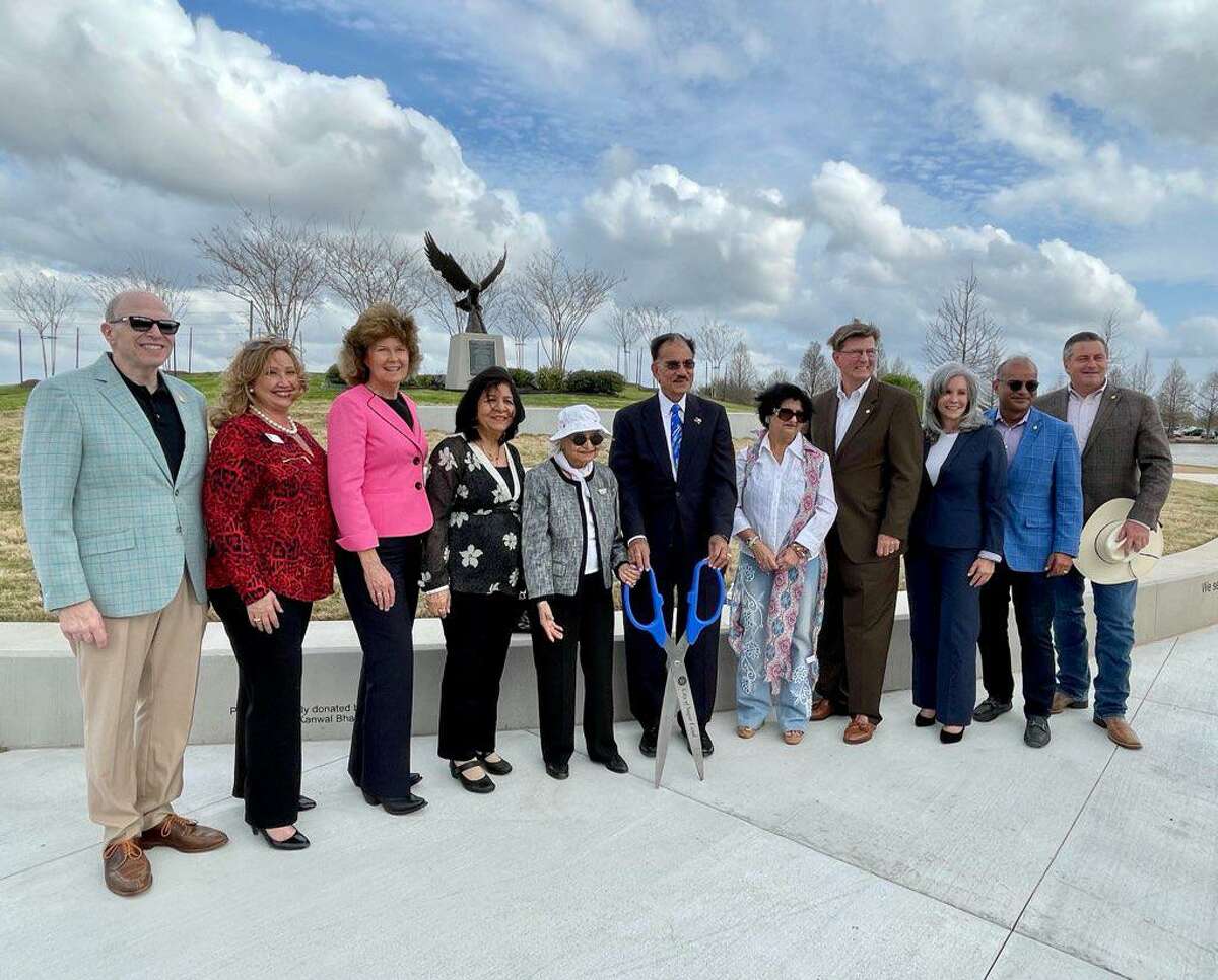 Sugar Land officials turned out recently to join community members at the ribbon cutting for Phase 2 of the Memorial Eagle Project. From left are Councilor Stewart Jacobson, Councilor Jennifer Lane, Councilor Carol McCutcheon, Kanwal Bhalla, Sunny Sharma, Rashmi Sharma, Mayor Joe Zimmerman, Councilor Suzanne Whatley, Councilor Naushad Kermally and Councilor William Ferguson.