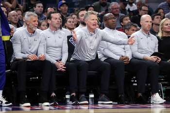 Golden State Warriors' head coach Steve Kerr and his staff during 110-88 loss to Boston Celtics during NBA game at Chase Center in San Francisco, Calif., on Wednesday, March 16, 2022.