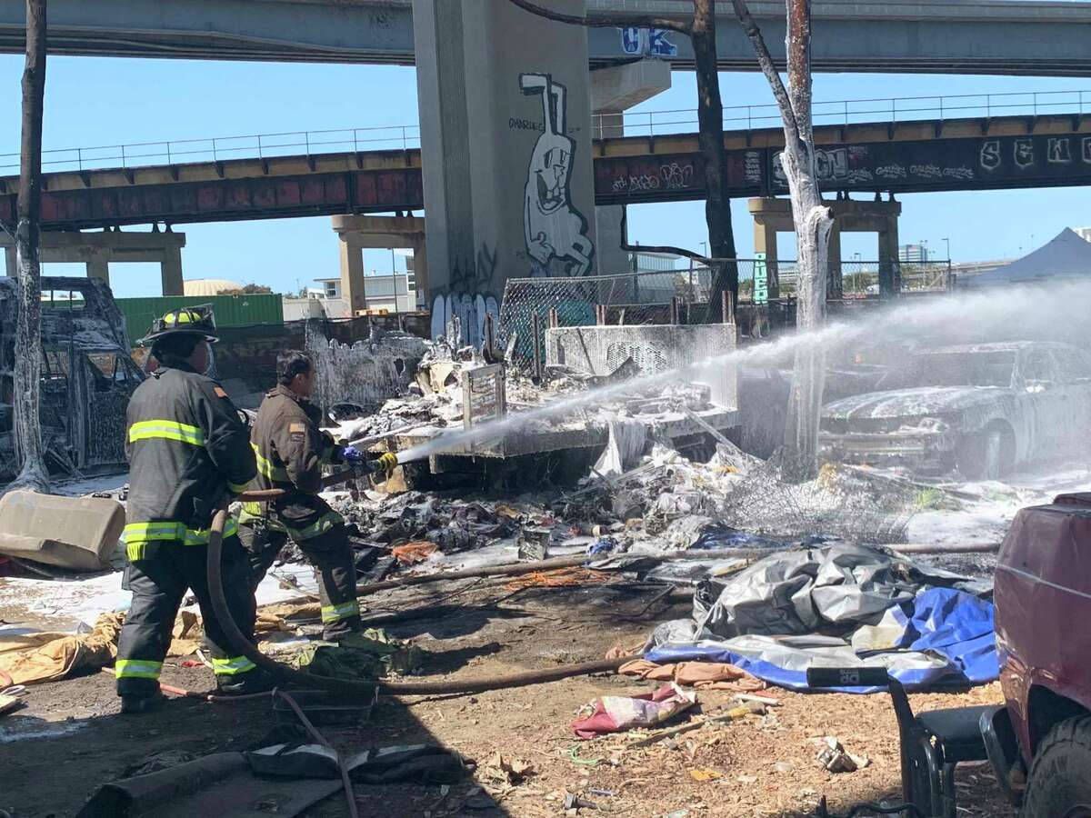 A fire that consumed multiple vehicles, including three RVs, in a West Oakland encampment Tuesday afternoon left one person dead and five more without shelter, officials said.