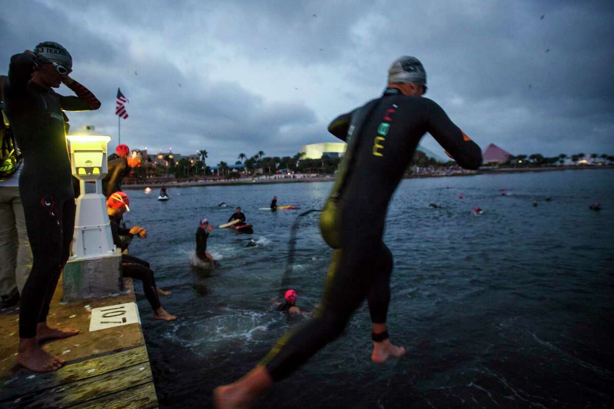 File photo shows triathletes prepare before the start of the 2012 Memorial Hermann Ironman 70.3 Texas, Sunday, April 1, 2012, in Galveston.
