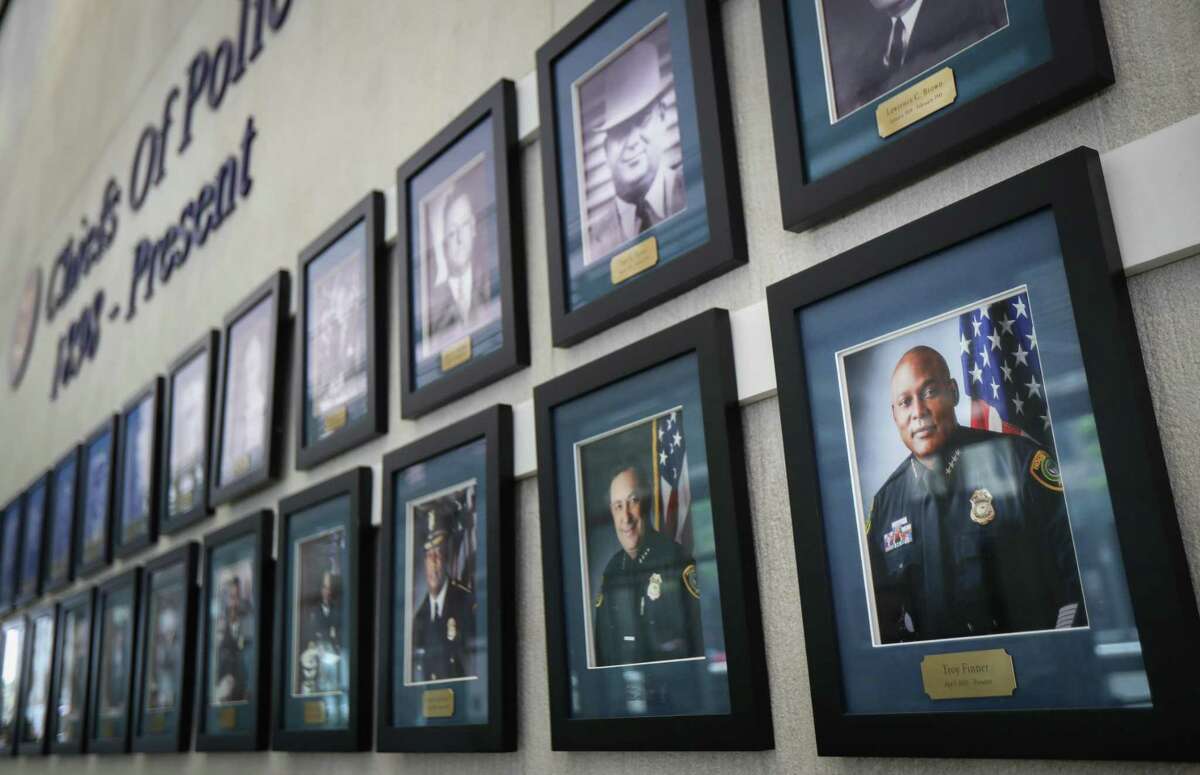 A portrait of Houston Police Chief Troy Finner is displayed with former police chiefs Tuesday, April 5, 2022, at HPD headquarters in Houston.