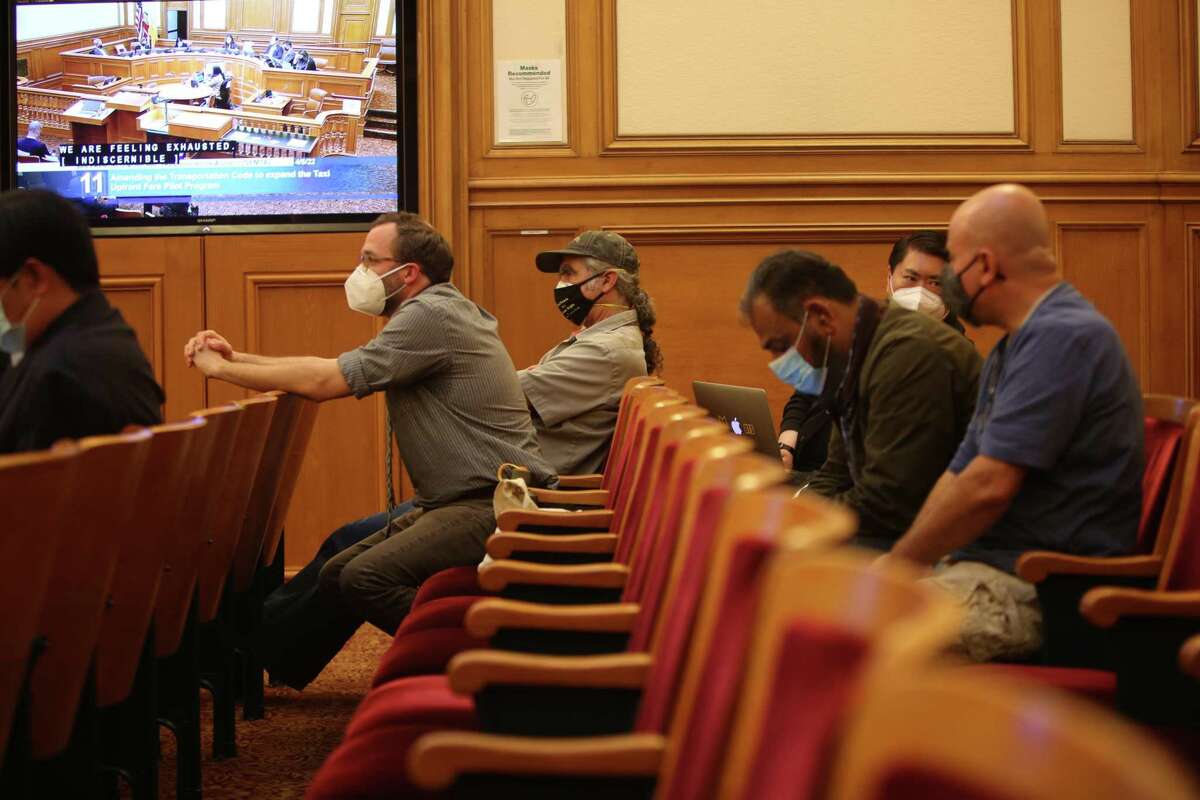 A hand full of taxi drivers waiting anxiously as board discusses the decision on the Taxi Upfront Fare Pilot program in San Francisco , Calif. on Tuesday, April 5, 2022.