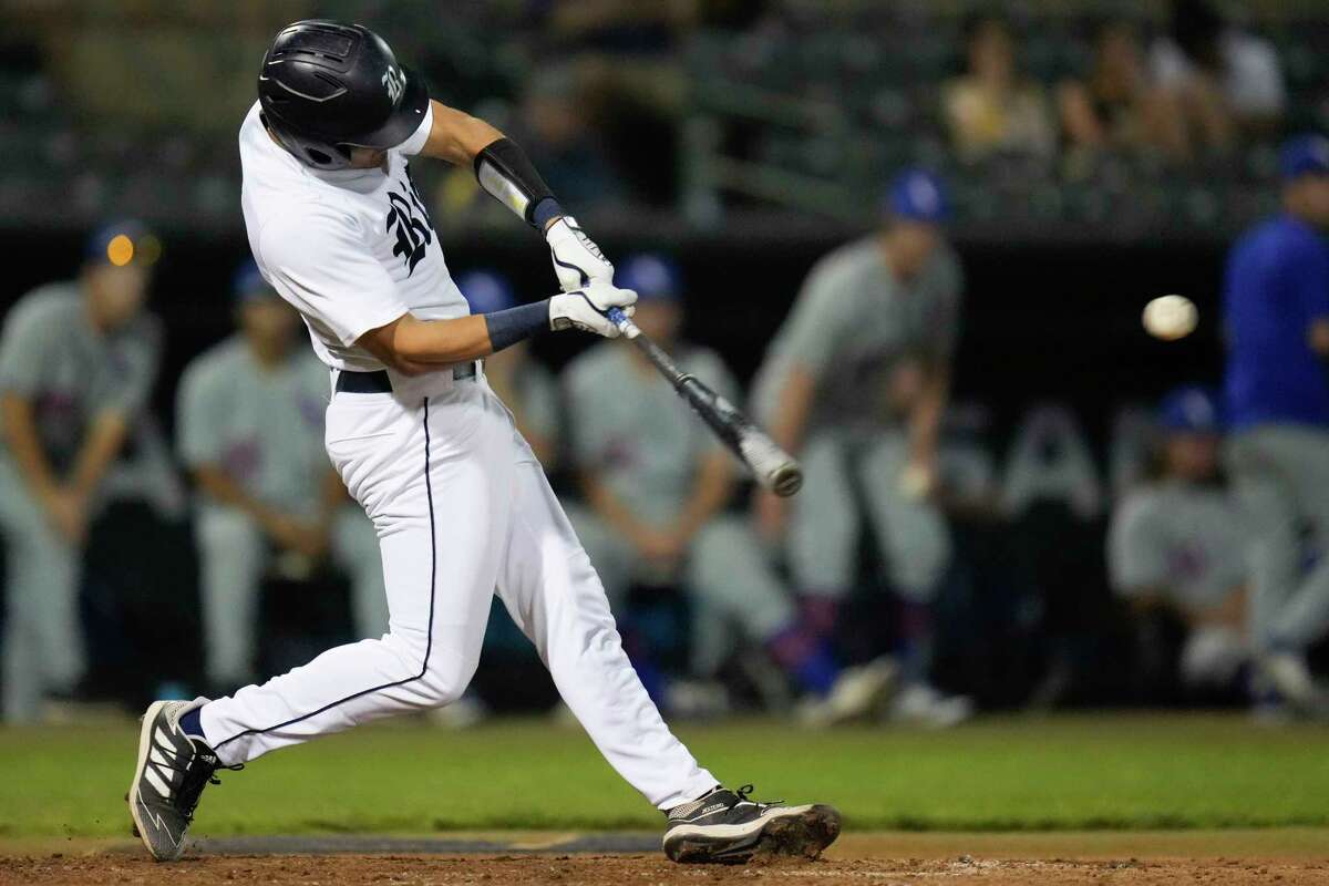 Rice’s Antonio Cruz hits a 2-run triple during the fifth inning of an NCAA college baseball game against Houston Baptist, Tuesday, April 5, 2022, in Houston.