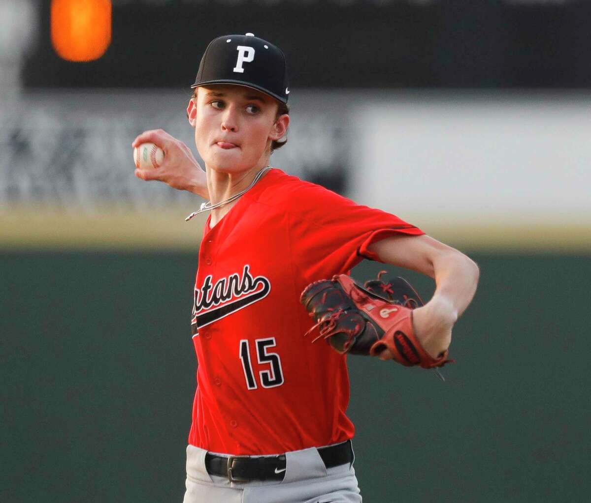 Porter starting pitcher Colin Carney (15) throws in the first inning of a District 20-5A high school baseball game, Tuesday, April 5, 2022, in New Caney.
