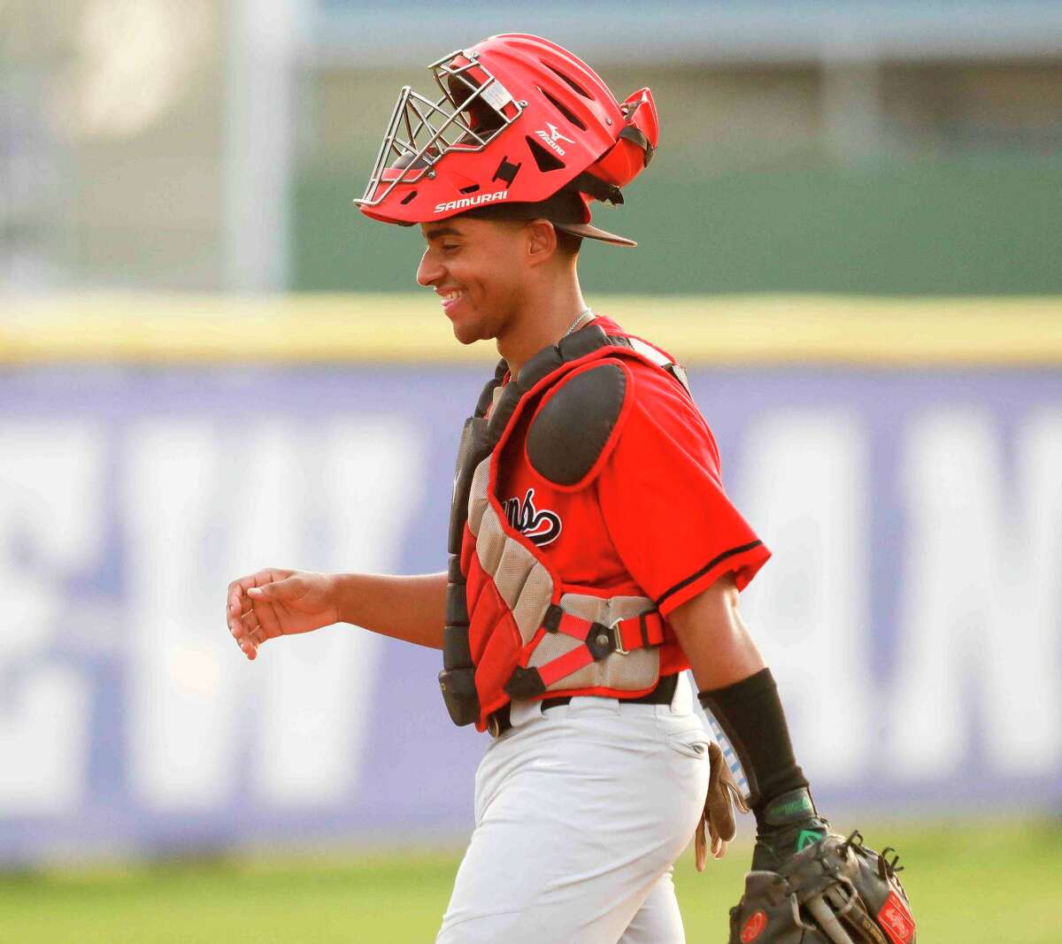 Porter catcher Victor Fortuna (23) laughs between batters in the first inning of a District 20-5A high school baseball game, Tuesday, April 5, 2022, in New Caney.