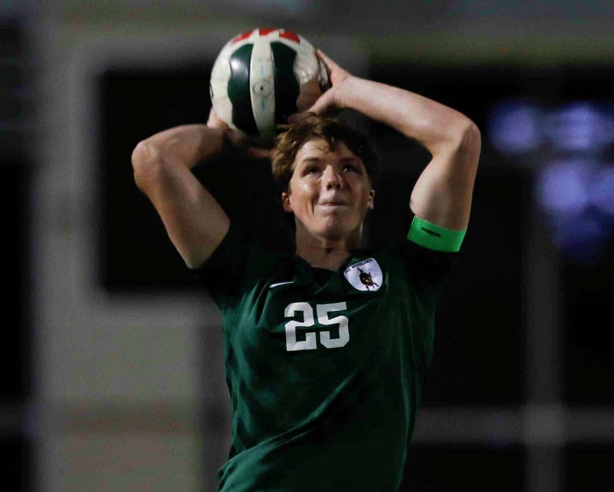 The Woodlands' Nathan Boyles (25) throws the ball in bounds in the first period of a Region II-6A quarterfinal high school playoff soccer match at Woodforest Bank Stadium, Friday, April 1, 2022, in Shenandoah.