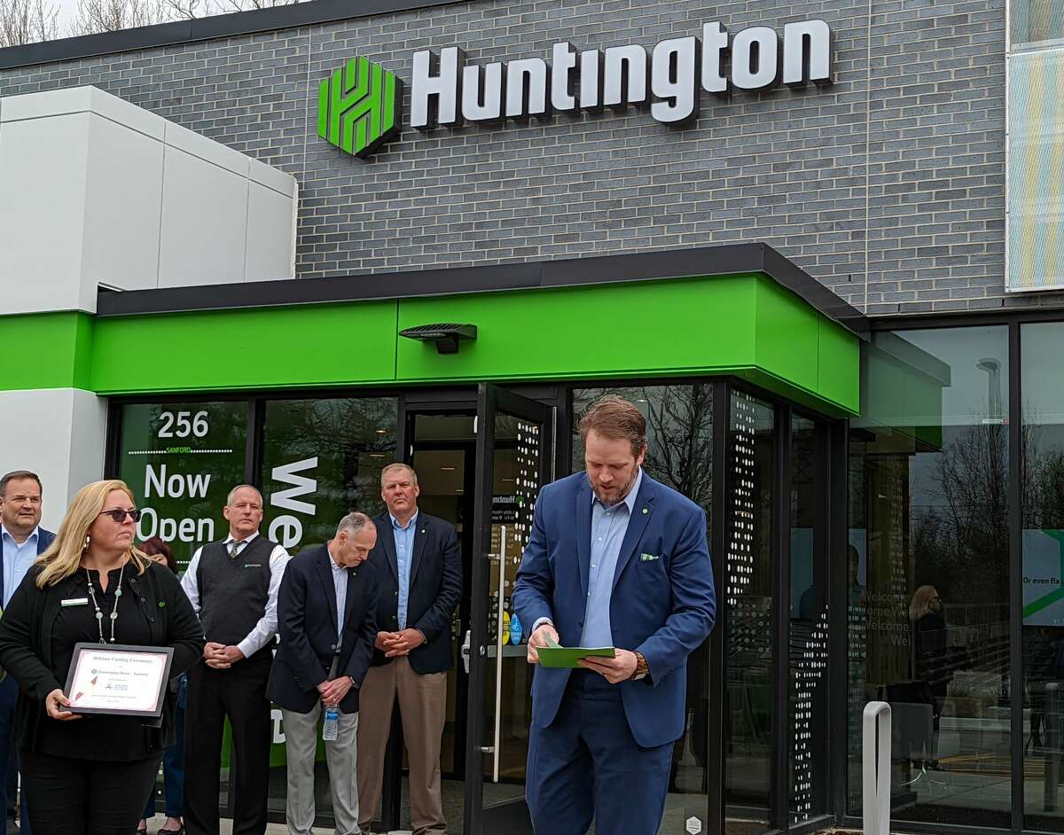 Huntington Bank Great Lakes Bay and Norther Michigan Region President Seth Perigo speaks during the Sanford bank branch's grand opening Tuesday. 