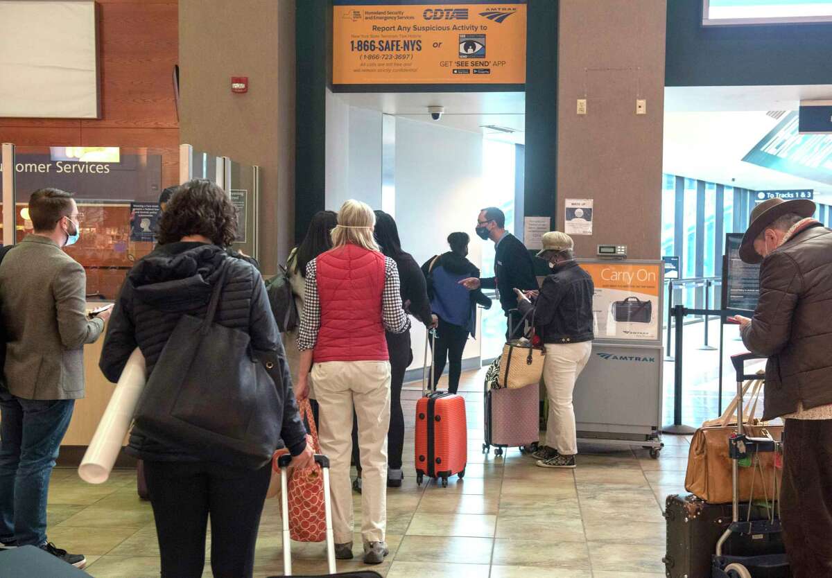 Amtrak passengers have their boarding tickets checked on their way to the boarding platform at Albany-Rensselaer Train Station on Wednesday, April 6, 2022 in Rensselaer, N.Y.
