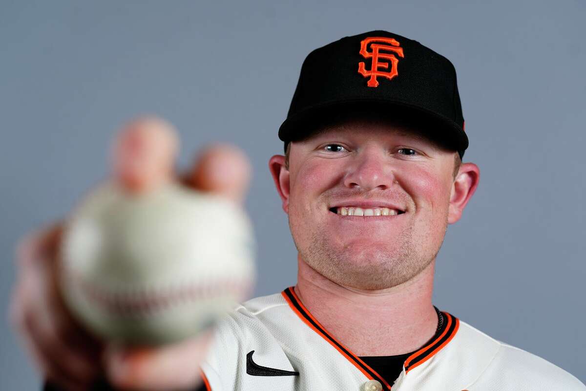 San Francisco Giants pitcher Logan Webb poses for a photograph at the Giants baseball team photo day Friday, March 18, in Scottsdale, Ariz.