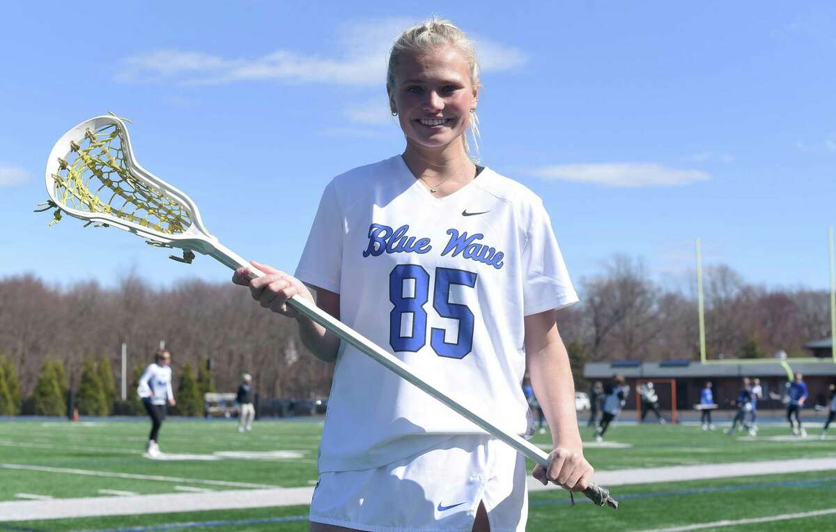 Darien's Molly McGuckin, a captain of the girls lacrosse team, wears the Blue Wave's No. 85 jersey, which honors Jon Schoen, a former Darien and Boston College football player who died in 2017. Schoen wore the No. 85 at Boston College.