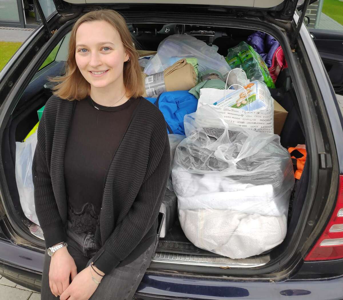 Emily Kilgannon-Neumann, a Fairfield Warde graduate, lives in Germany and is helping Ukrainian refugees fleeing the war by participating in relief convoys.