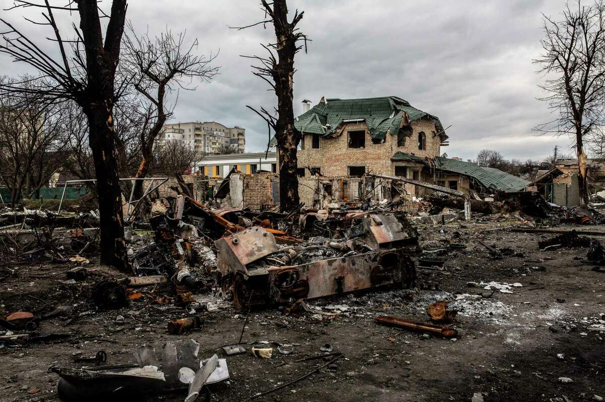 Destroyed Russian military equipment litters Bucha, Ukraine, on Wednesday.
