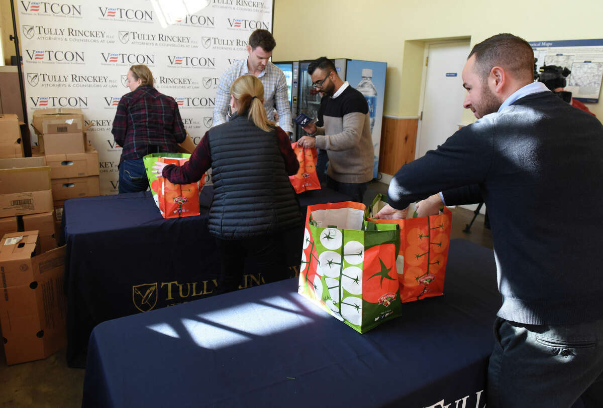 Tully Rinckey prepares to give Thanksgiving turkeys to local active duty and retired military personnel during the legal firm's 11th annual Turkeys for Veterans event on Tuesday, Nov. 26, 2019.