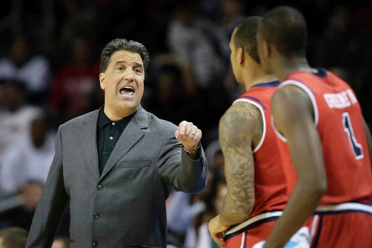St. John's head coach Steve Lavin directs his players in the first half of their NCAA college basketball game against Georgia Tech, the consolation game of the Barclays Center Classic, Saturday, Nov. 30, 2013, in New York. (AP Photo/John Minchillo) ORG XMIT: NYJM103