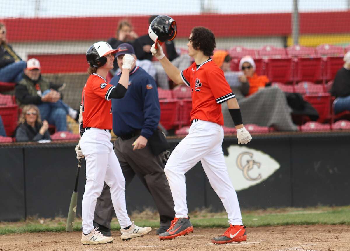 Edwardsville's Lucas Huebner is congratulated by Cole Funkhouser after hitting a home run in the second inning against Granite City on Wednesday at Babe Champion Field in Granite City.