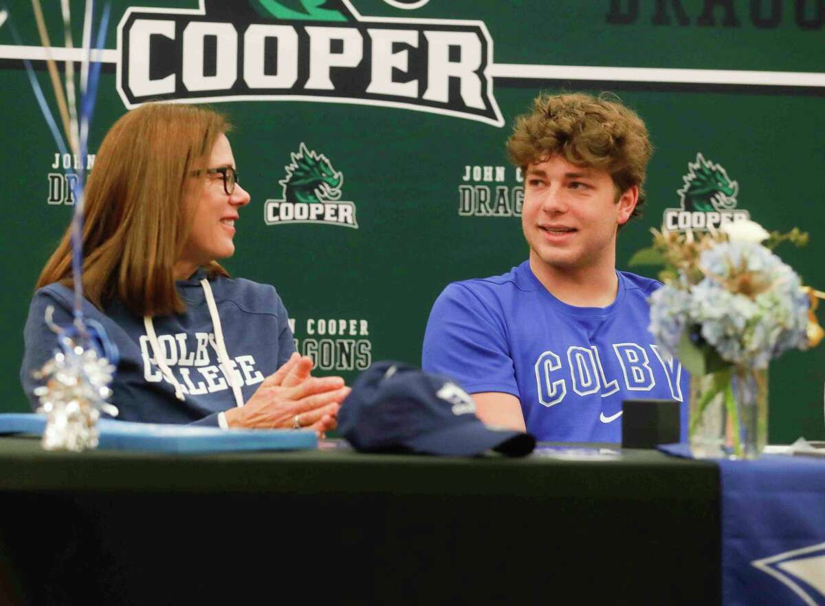 John Cooper football players receive SPC championship rings at signing day