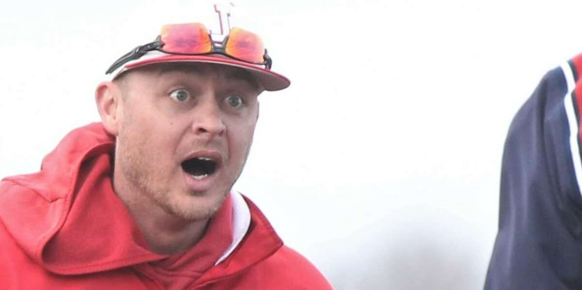 Jacksonville baseball coach Cory Bunner reacts after a JHS baserunner was called out at third Wednesday.