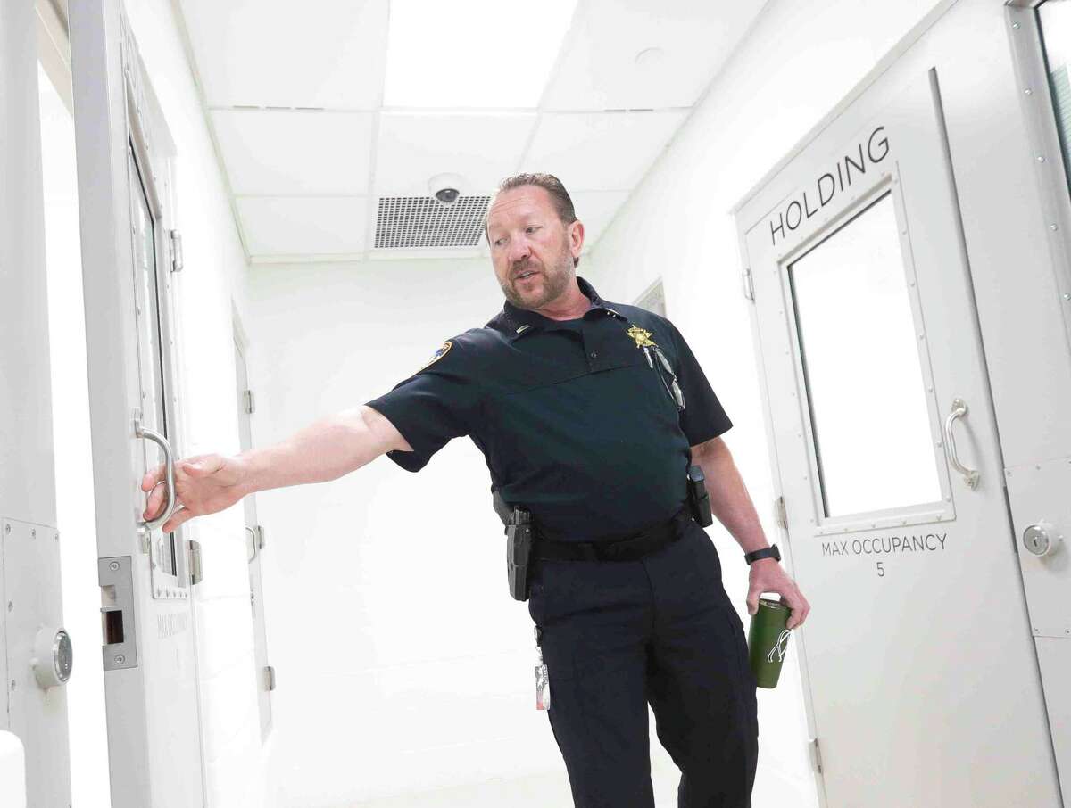 Lt. John Schmitt with the Montgomery County Sheriff’s Office shows on of the multi-person jail cells in the department’s new, $11.8 million state-of-the-art District 4 building, Thursday, April 7, 2022, in Magnolia. In addition to serving as a location for deputies’ daily work, the 16,760 square foot facility can hold up to 23 people who have been detained.
