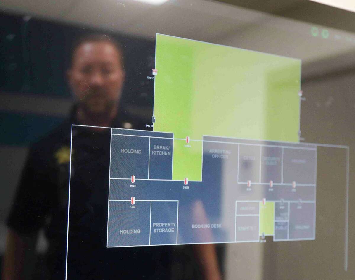 Lt. John Schmitt with the Montgomery County Sheriff’s Office discusses the touchscreen controls that operate the jail cells in the department’s new, $11.5 million state-of-the-art District 4 building, Thursday, April 7, 2022, in Magnolia.