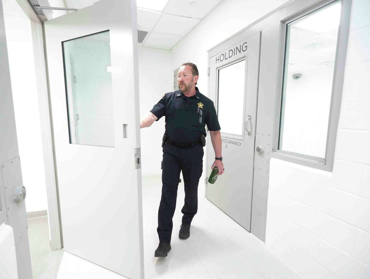 Lt. John Schmitt with the Montgomery County Sheriff’s Office shows on of the multi-person jail cells in the department’s new, $11.5 million state-of-the-art District 4 building, Thursday, April 7, 2022, in Magnolia. In addition to serving as a location for deputies’ daily work, the 16,760 square foot facility can hold up to 23 people who have been detained.