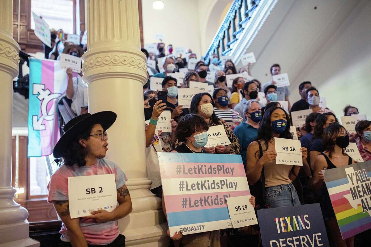 LGBTQ rights supporters gather at the Texas State Capitol to protest state Republican-led efforts on Sept. 20, 2021, in Austin, Texas.