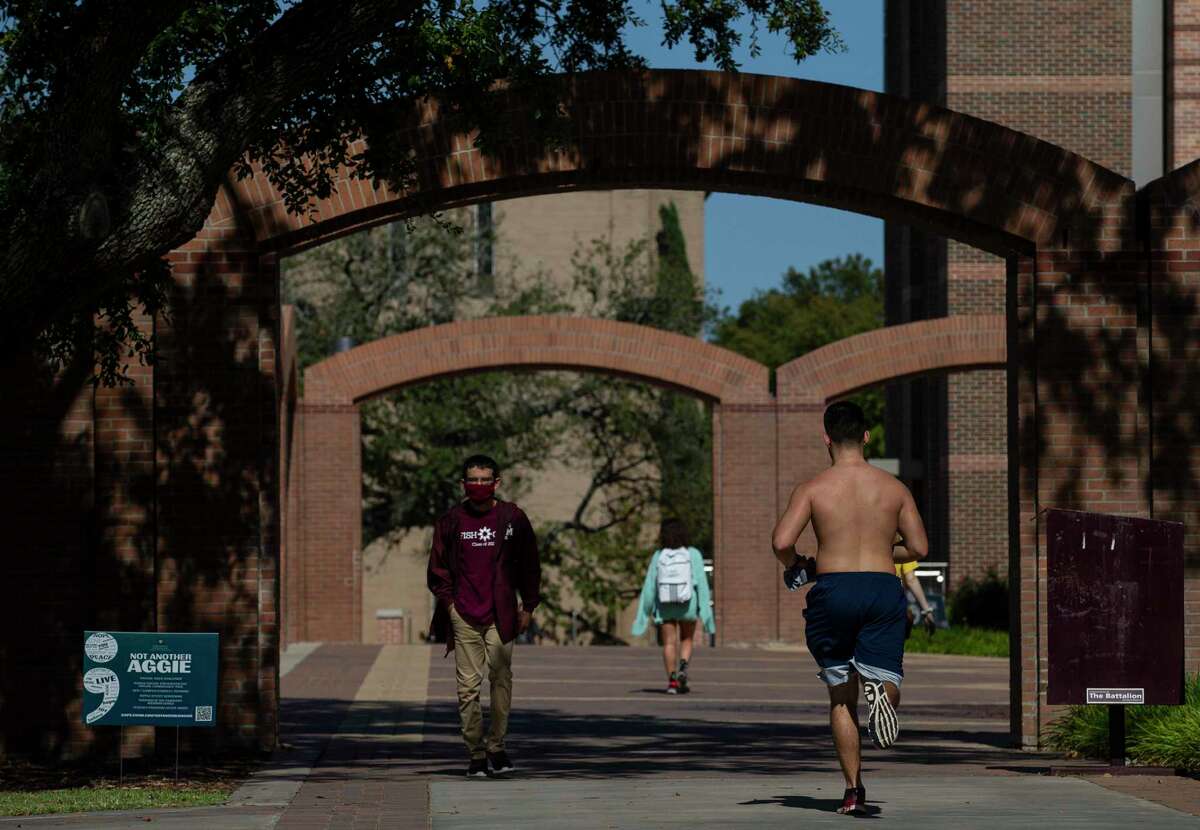 Texas A&M students on campus Friday, Oct. 2, 2020, in College Station, Texas.