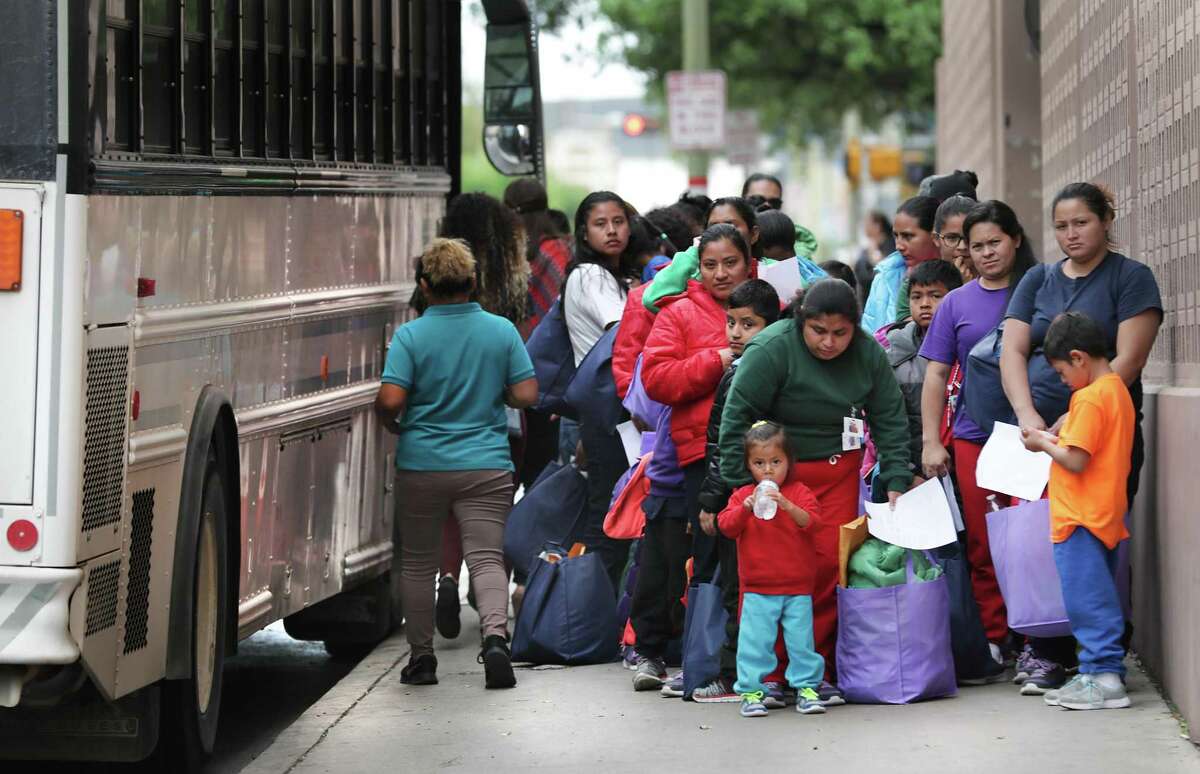 Migrants released from Texas detention centers arrive in 2019 at the San Antonio bus station.