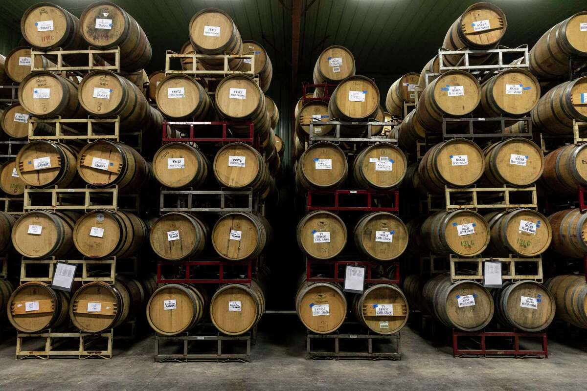 Barrels of wine age inside the wine cellar at Bending Branch Winery.