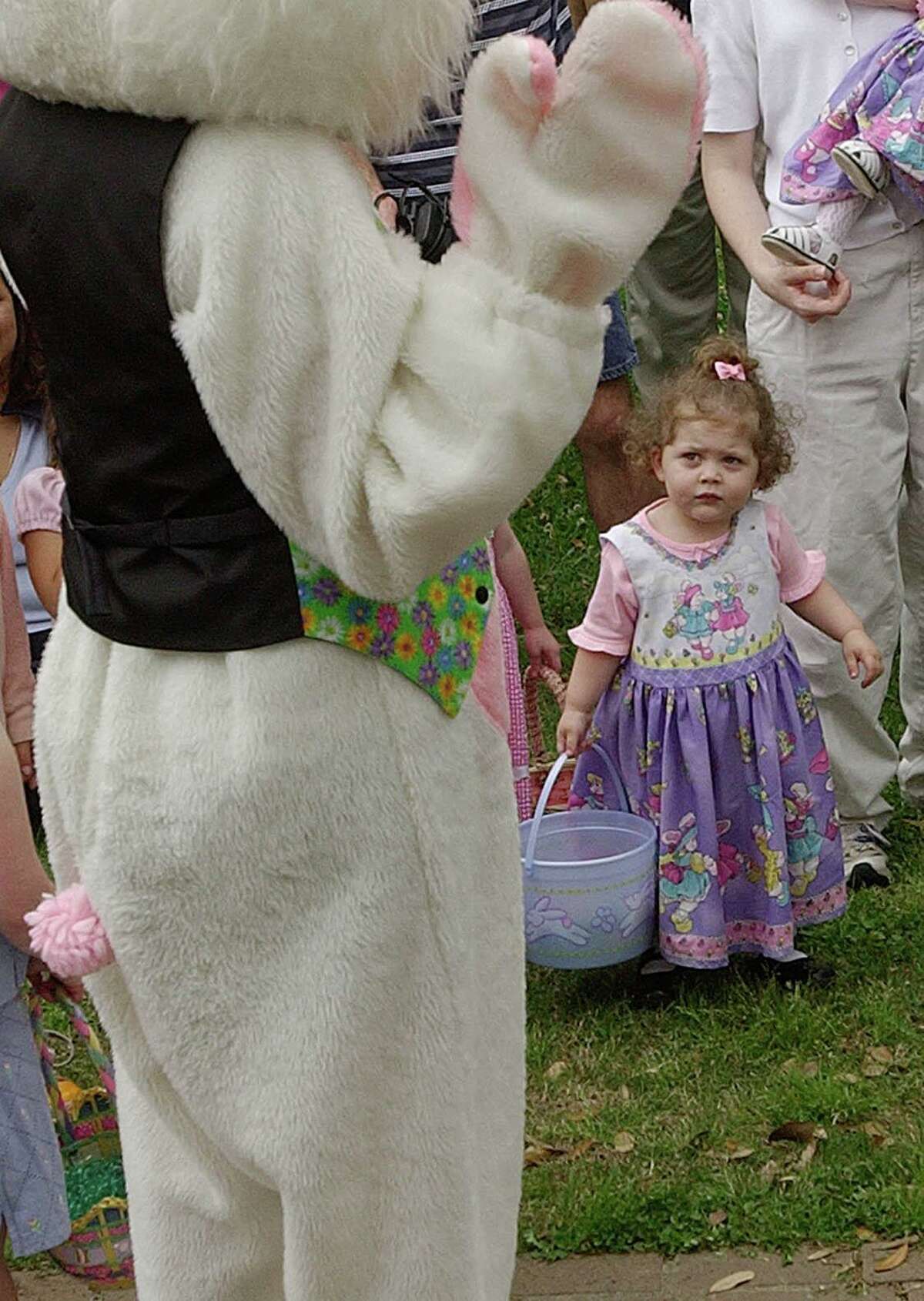 Catherine Zwingman, 2, isn't quite sure what to make of the Easter Bunny during an egg hunt in Stevenson Park in Friendswood in 2002. This year, the hunt will be at 1 p.m. Sunday, April 10 in the park.