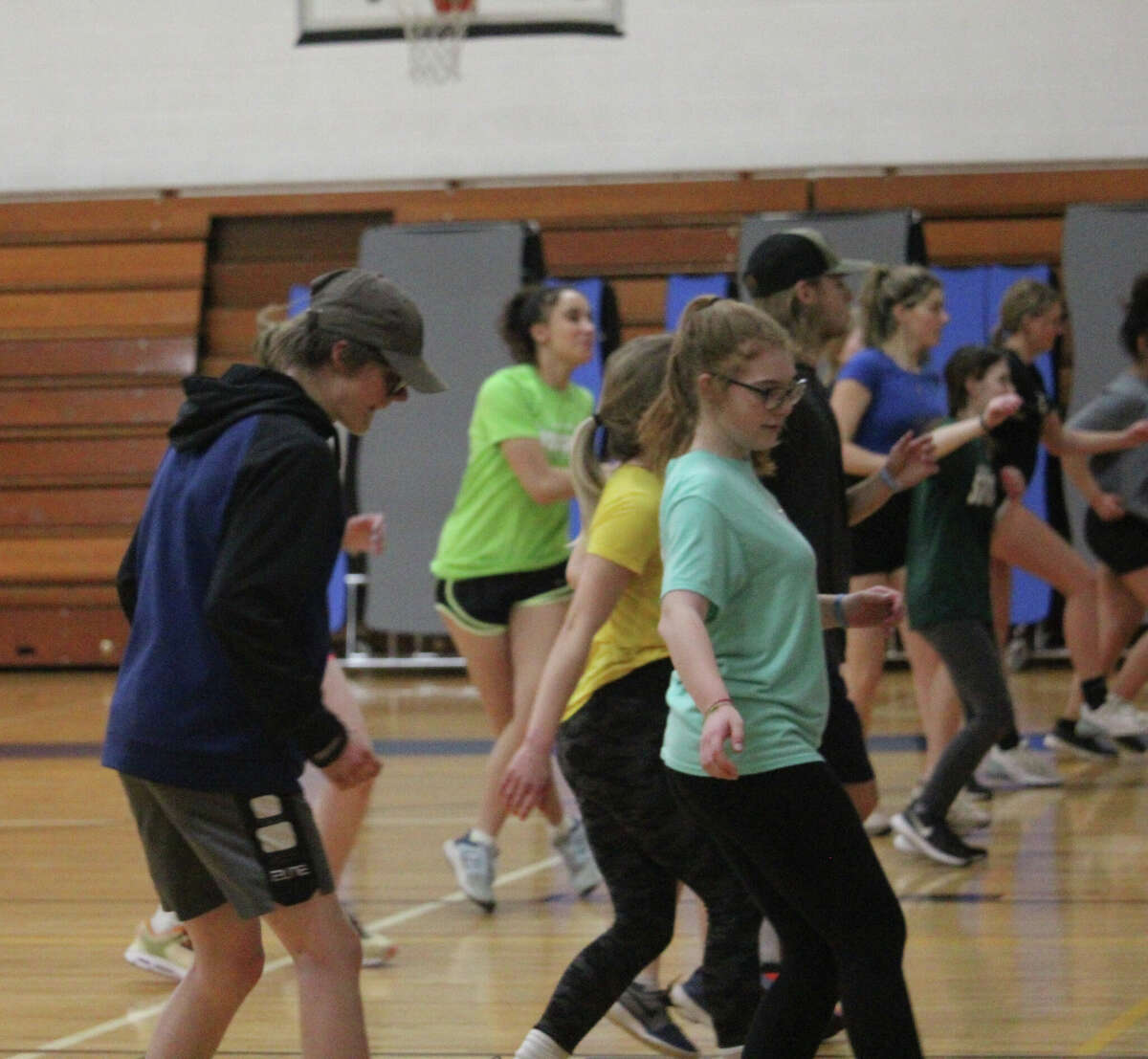 Morley Stanwood track and field athletes go through a workout in the elementary gymnasium.