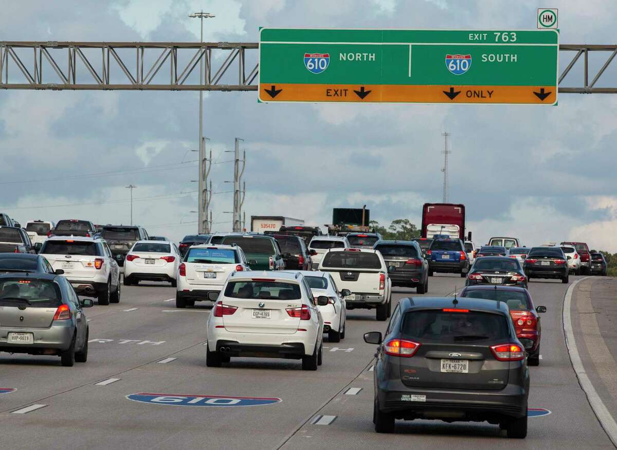 Rush hour traffic slogs along Interstate 10 eastbound toward Loop 610 on Oct. 12, 2021, in Houston. Crews will close eastbound I-10 in the area this weekend to work on a pedestrian bridge at Post Oak.
