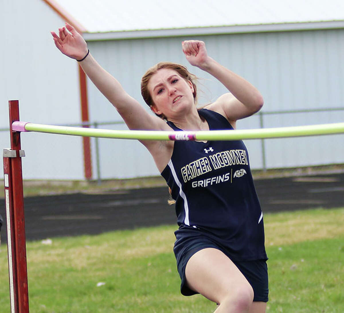 McGivney's Mia Range reaches liftoff with the bar at 5-2 in meet last week at Highland.