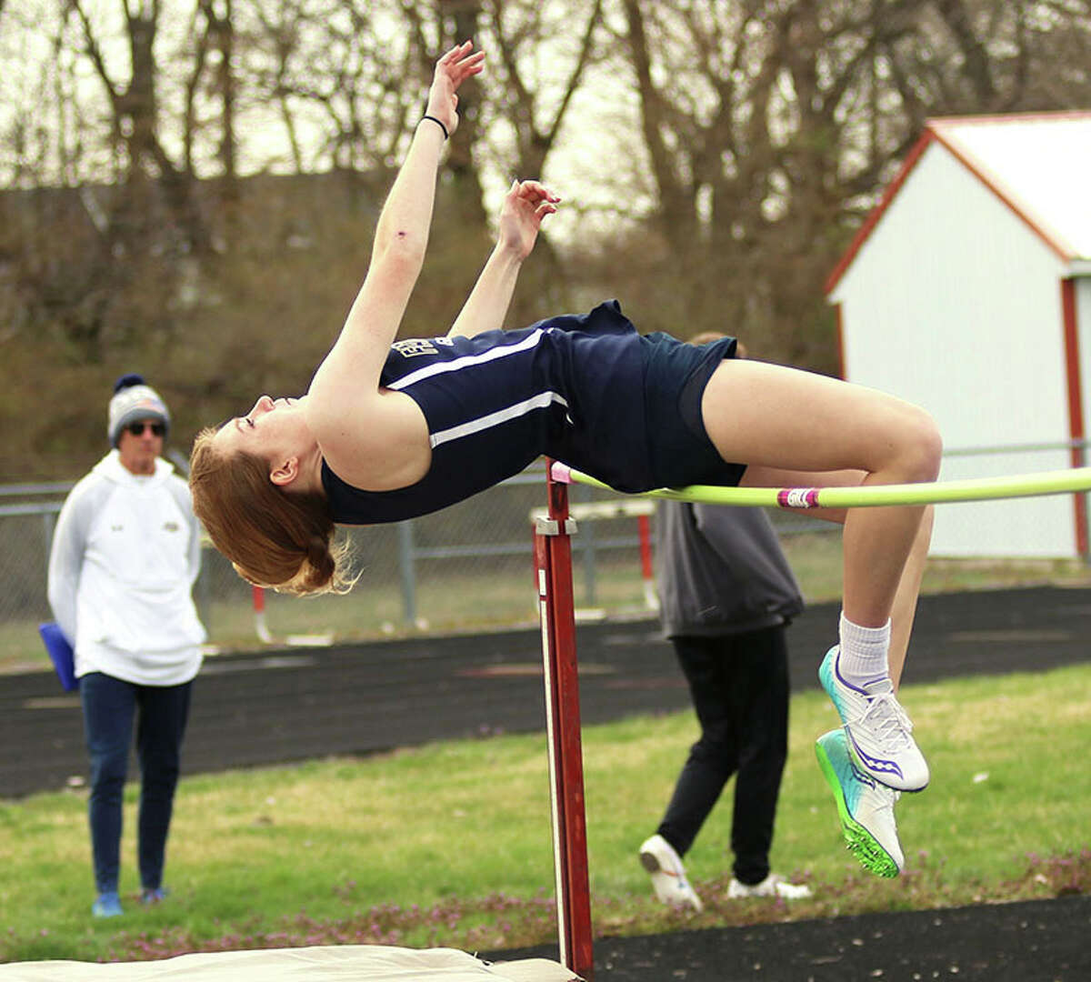 Mia Range clears the bar at 5 feet, 2 inches to win high jump in an eight-team March 29 in Highland. The Father McGivney freshman earlier in March won an indoor state title by going 5-3 1/2 at the Top Times Indoor Championships in Bloomington.