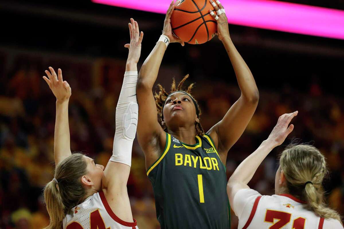 Baylor forward NaLyssa Smith, shooting over Iowa State’s Ashley Joens and forward Morgan Kane, is projected as a top 3 pick in the upcoming WNBA draft.