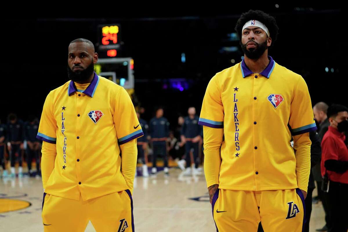 Los Angeles Lakers forward LeBron James, left, and forward Anthony Davis stand together before an NBA basketball game against the New Orleans Pelicans in Los Angeles, Friday, April 1, 2022.