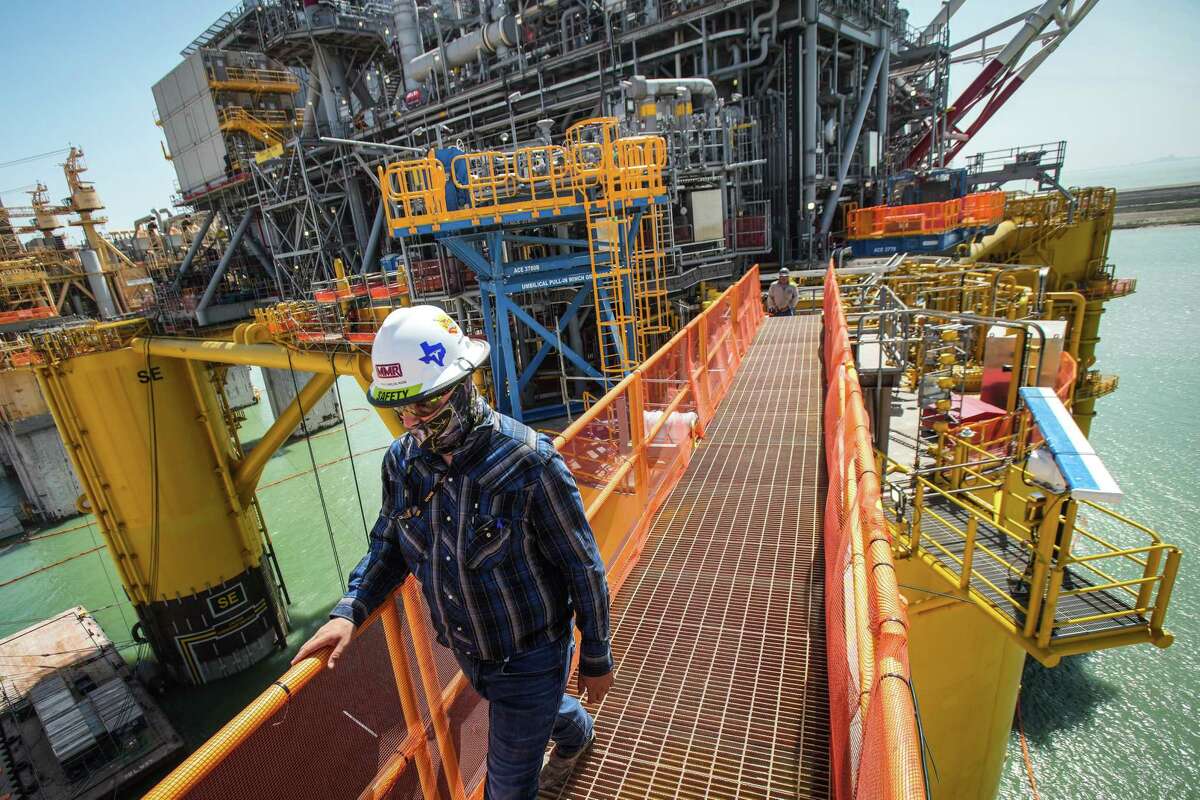 A worker walks across the gangplank as he leaves Shellís Vito platform during construction on the project at the Kiewit Offshore Services complex Wednesday, April 6, 2022 in Ingleside.