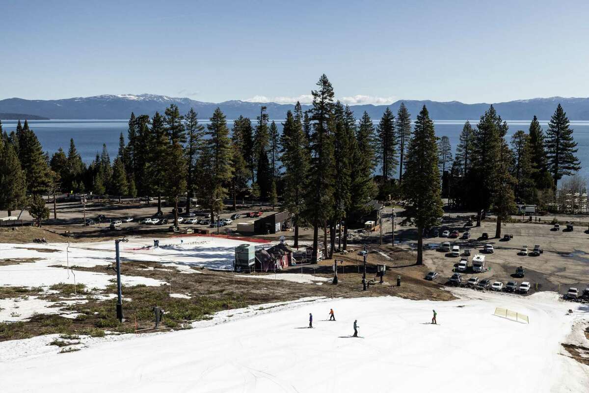 Skiers ski right to the parking lot at Homewood Mountain Resort, which sits right along the road and Lake Tahoe. The ski area has been a favorite of locals, but the owners are considering making it a members only resort.
