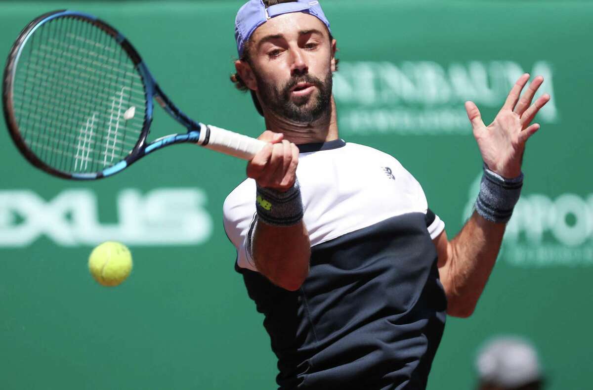 Jordan Thompson, AUS, returns a serve from Christian Garin, CHI, during the second round of the Fayez Sarofim & Co. U.S. Men’s Clay Court Championship at River Oaks Country Club in Houston on Thursday, April 7, 2022.