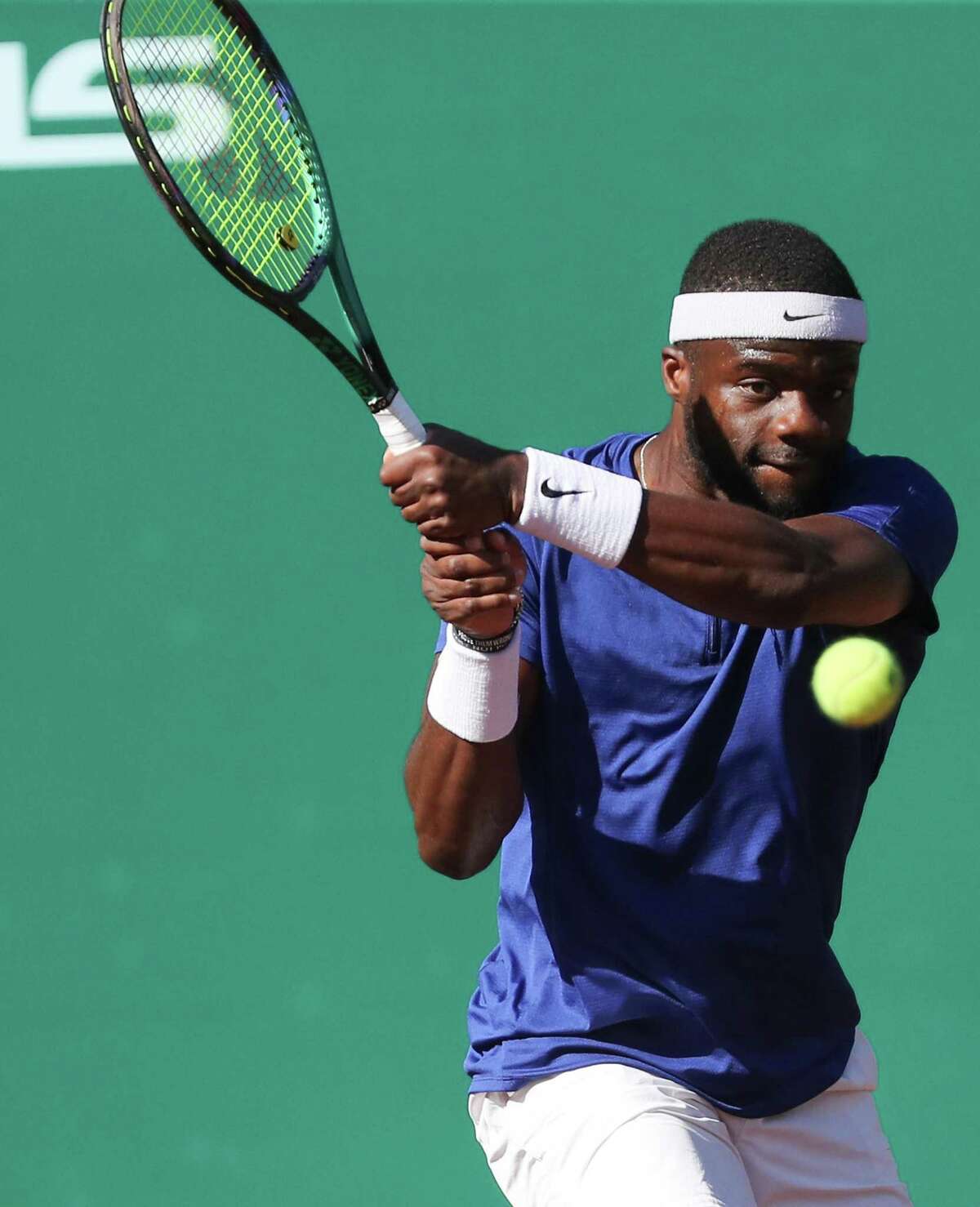 Frances Tiafoe, USA, returns a serve by Pablo Cuevas, URU, during the second round of the Fayez Sarofim & Co. U.S. Men’s Clay Court Championship at River Oaks Country Club in Houston on Thursday, April 7, 2022.