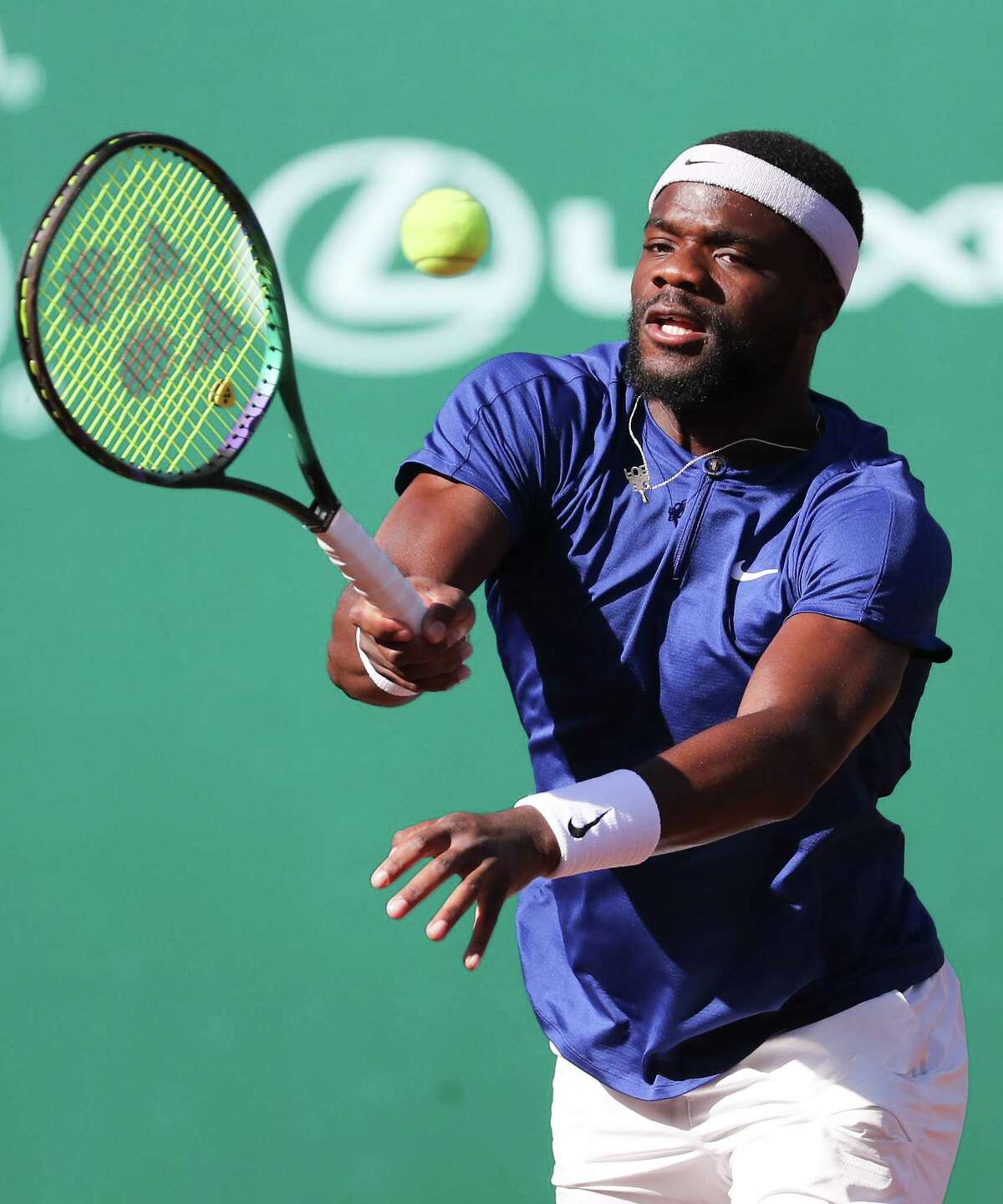 Frances Tiafoe, USA, returns a serve by Pablo Cuevas, URU, during the second round of the Fayez Sarofim & Co. U.S. Men’s Clay Court Championship at River Oaks Country Club in Houston on Thursday, April 7, 2022.