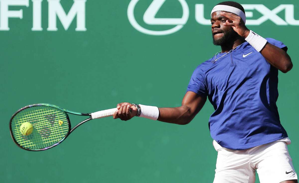Frances Tiafoe, USA, returns a serve by Pablo Cuevas, URU, during the second round of the Fayez Sarofim & Co. U.S. Men’s Clay Court Championship at River Oaks Country Club in Houston on Thursday, April 7, 2022.