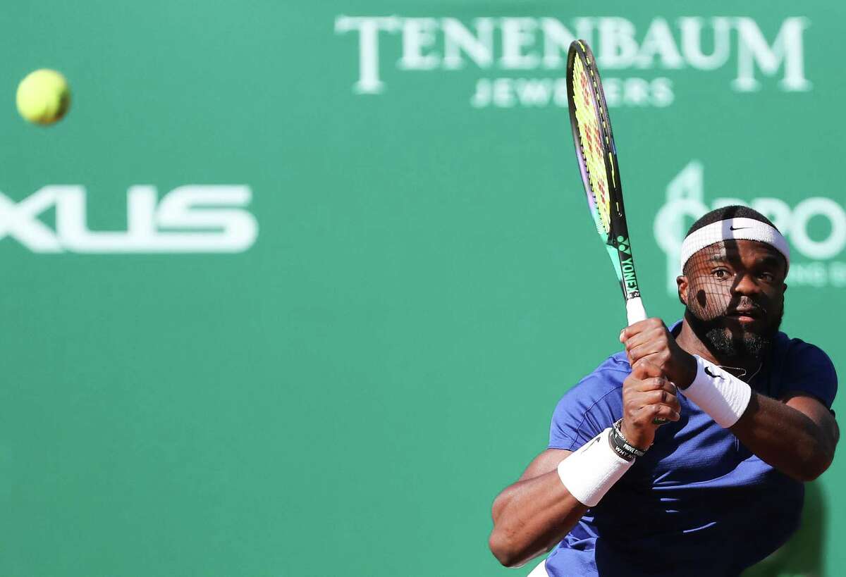 Frances Tiafoe, USA, returns a serve by Pablo Cuevas, URU, during the second round of the Fayez Sarofim & Co. U.S. Men’s Clay Court Championship at River Oaks Country Club in Houston on Thursday, April 7, 2022.