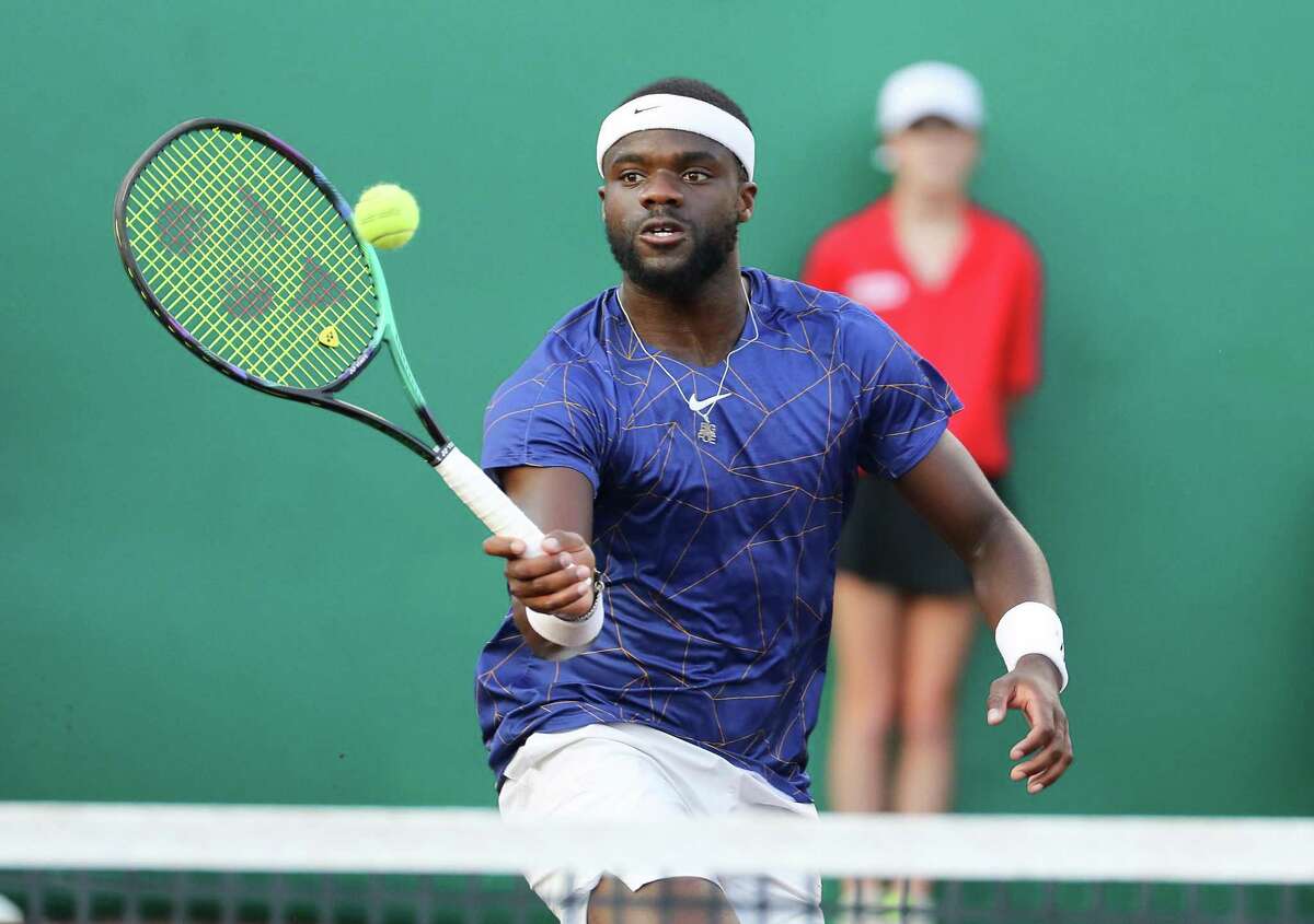 France Tiafoe, USA, returns a hit to Pablo Cuevas, URU during the second round of the Fayez Sarofim & Co. U.S. Men’s Clay Court Championship at River Oaks Country Club in Houston on Thursday, April 7, 2022. Tiafoe won in a 3rd set tie breaker.
