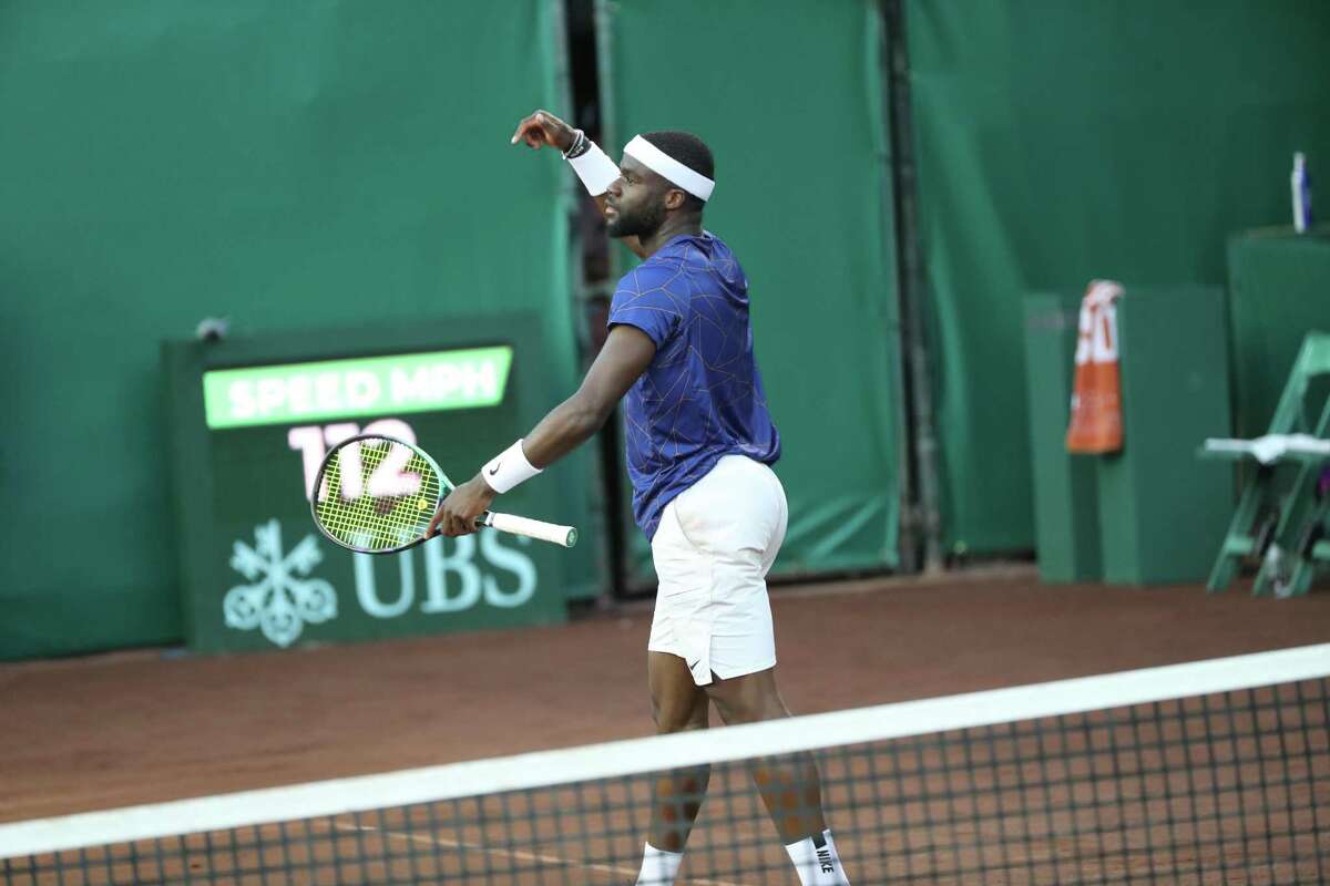 France Tiafoe, USA, tries to hype up the crowd while competing against Pablo Cuevas, URU, during the second round of the Fayez Sarofim & Co. U.S. Men’s Clay Court Championship at River Oaks Country Club in Houston on Thursday, April 7, 2022. Tiafoe won in a 3rd set tie breaker.