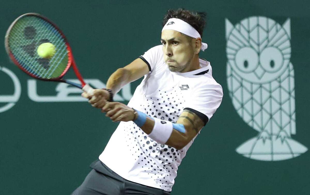 Alejandro Tabilo, CHI, returns a serve from Taylor Fritz, USA, during the second round of the Fayez Sarofim & Co. U.S. Men’s Clay Court Championship at River Oaks Country Club in Houston on Thursday, April 7, 2022. Fritz won the match 6-1, 6-4.