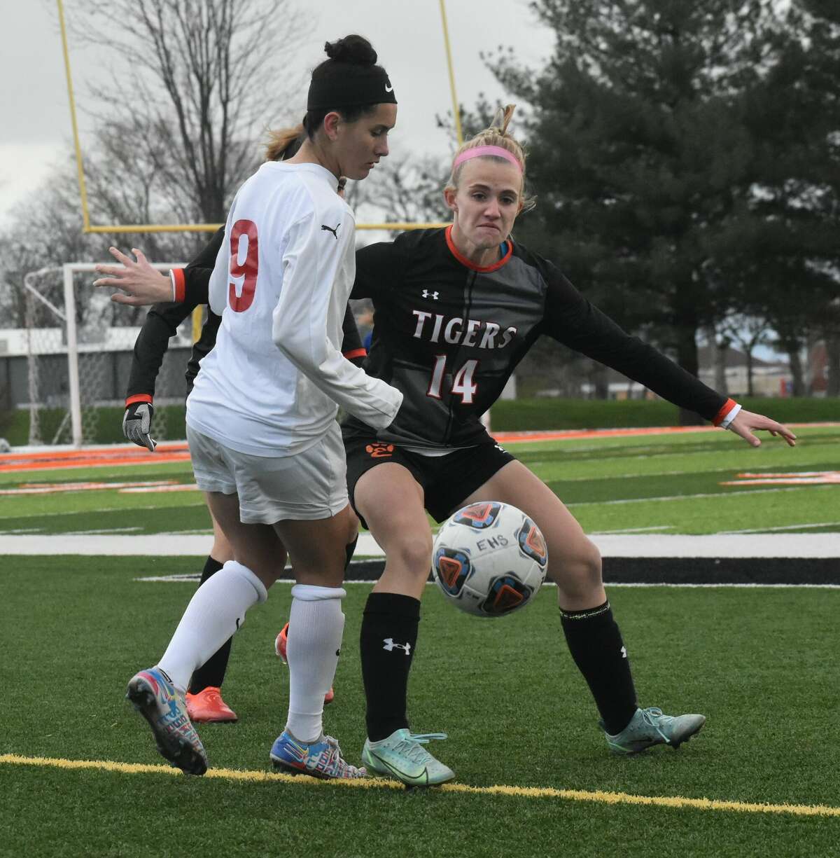 Edwardsville defender Ulla Sharp, right, keeps an eye on Alton's Emily Baker in the first half of a Southwestern Conference game in Edwardsville.