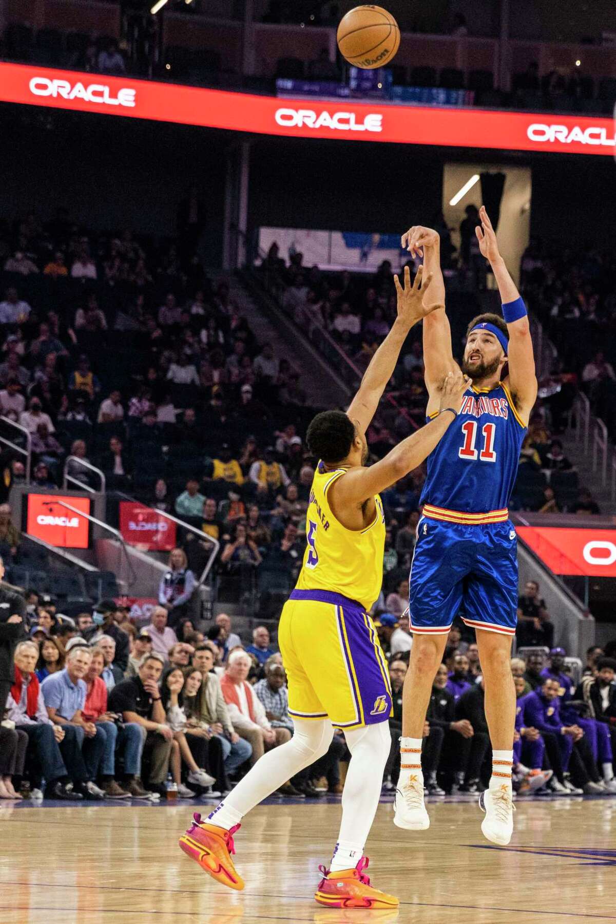 Golden State Warriors guard Klay Thompson shoots a three-pointer during the first quarter of his NBA basketball game against Los Angeles Lakers in San Francisco, Calif. Thursday, April 7, 2022.